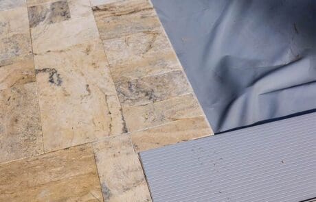 travertine pool deck installation - corner focus on mitered joint